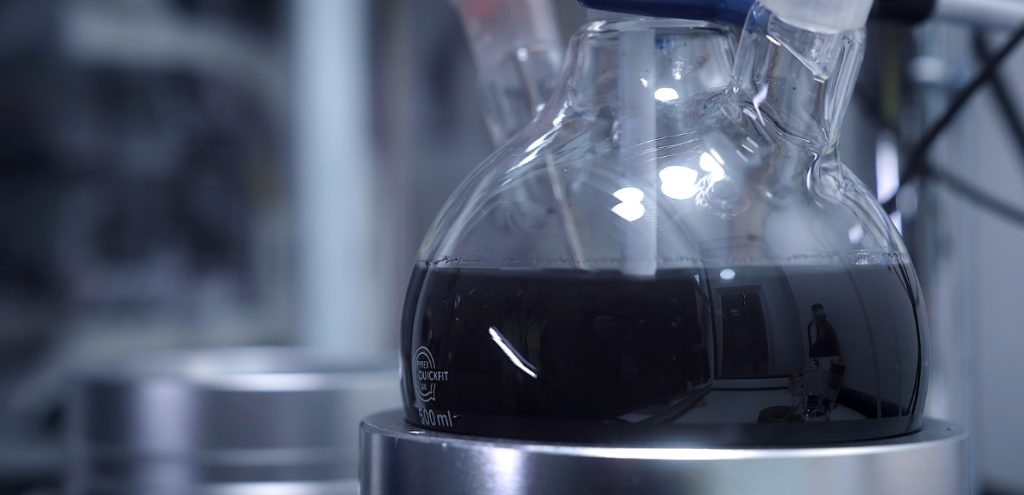 black solution of lithium battery material being refined in laboratory